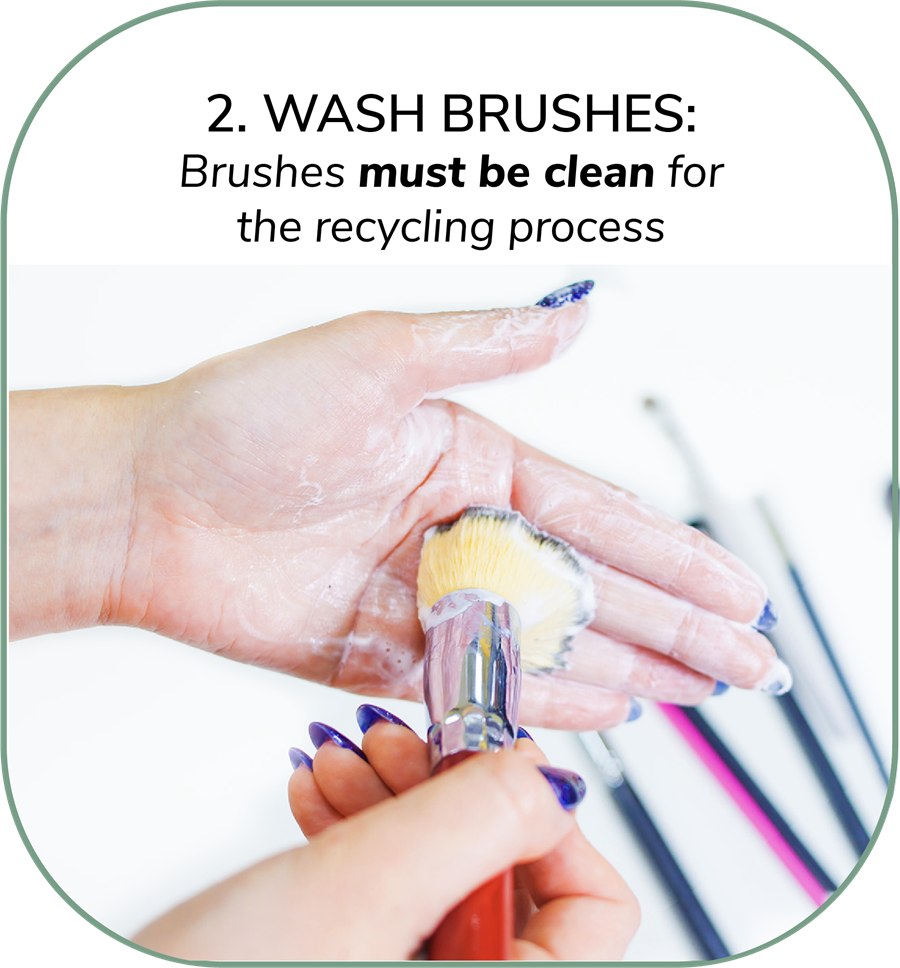 Step 2. Wash brushes — brushes must be clean for the recycling process. A brush being washed by hand.
